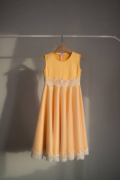 istock The yellow dress is hanging on a hanger. 1391650794