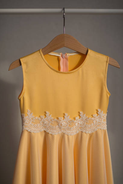 istock The yellow dress is hanging on a hanger. 1391650883