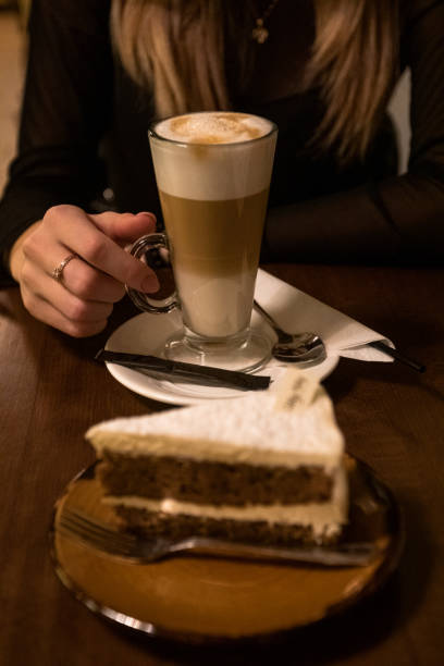 istock girl drinking coffee with cheesecake in a cafe 1391651647