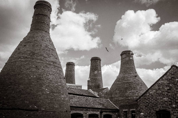 Mono picture of Bottle kilns against skyline in stoke on Trent A group of bottle kilns against a cloudy sky in stoke on Trent mono stoke on trent stock pictures, royalty-free photos & images