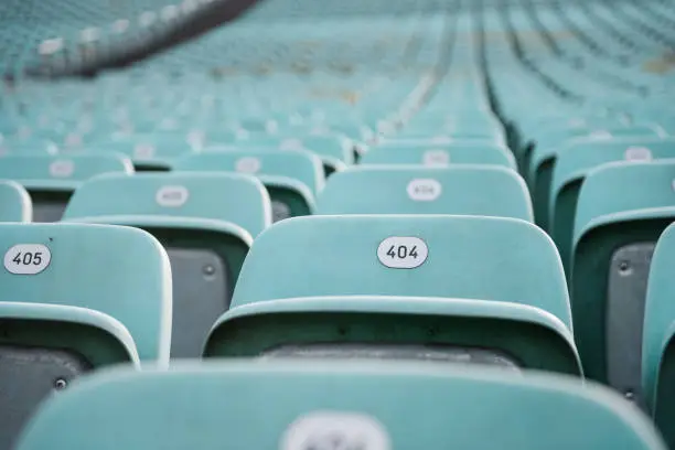 Error 404: seat not found. Rows of blue seats with numbers in a stadium