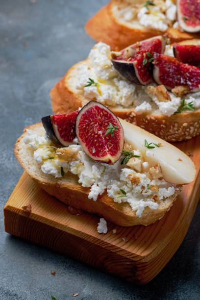 istock bruschetta with pears, cottage cheese, figs, thyme, nuts and honey. wine snacks 1391659519