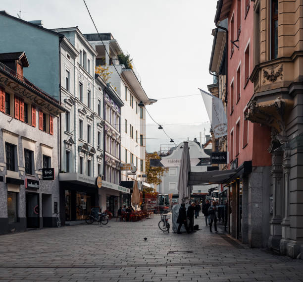 Narrow cobbled streets in the centher of small town Bregenz, Austria - October 24 2016: Narrow cobbled streets in the centher of small town. Soft light coming trough clouds on a foggy day bregenz stock pictures, royalty-free photos & images