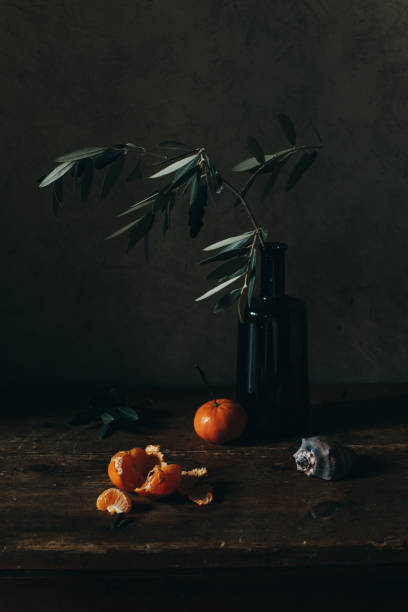 istock Still life with olive branch and tangerines. 1391663833