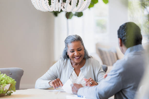 istock Couple sit and review retirement plan 1391663878