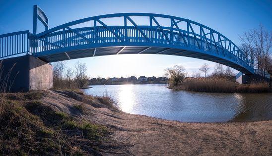 A footbridge at Blue Heron Pond in Windsor, Ontario in springtime