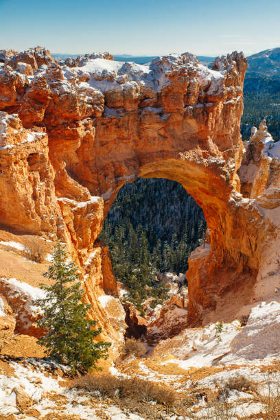 istock Natural Stone Bridge, Arch at Bryce Canyon with snow 1391666978