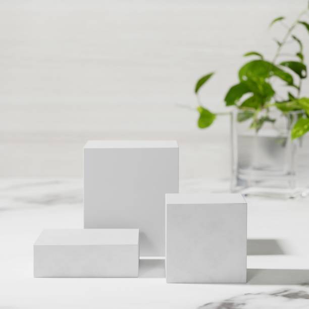 Product podium stage for mockup presentation, green plants, natural marble texture, background