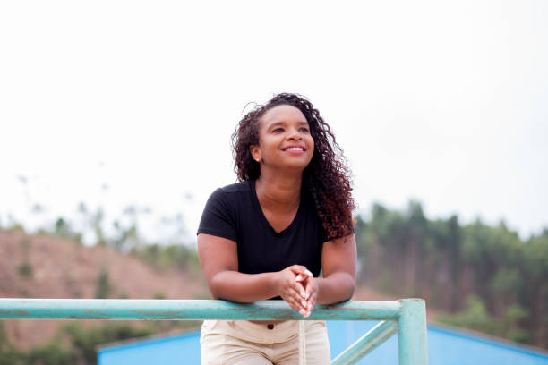 istock Young black woman smiling 1391669432