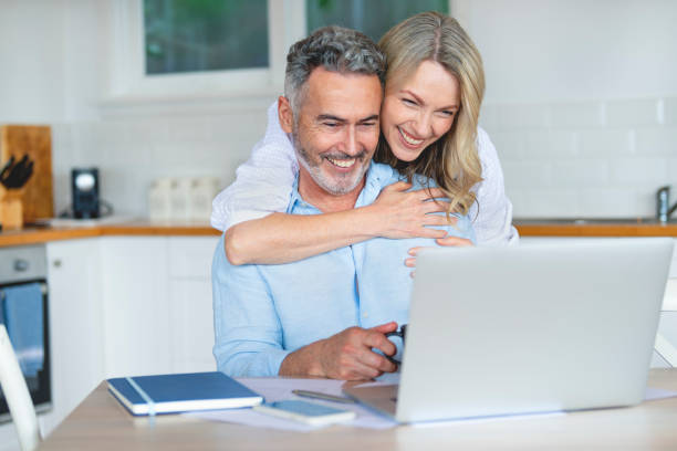 istock Mature couple doing paperwork at home. 1391671511