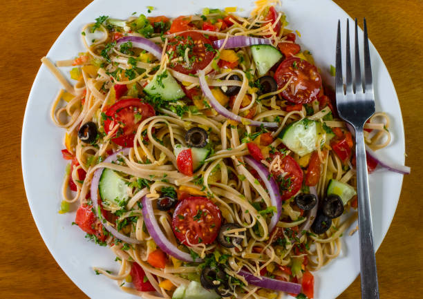 istock spaghetti salad with mixed vegetables and top with shreded cheese 1391673138
