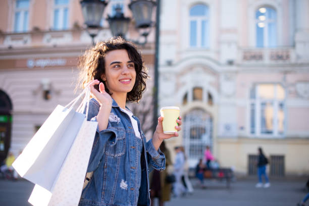 istock Young woman coming back from shopping 1391675492
