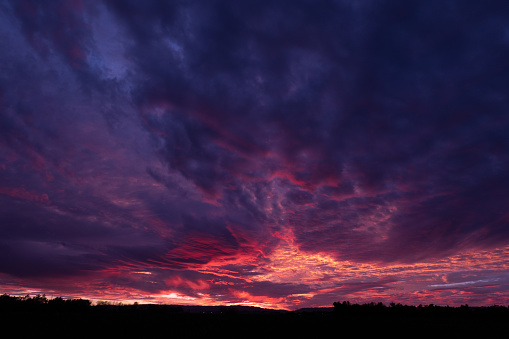 Dramatic sunset with purple blue and clouds