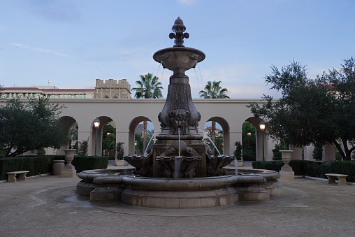 This image shows the courtyard and fountain in the Pasadena City Hall at dusk.