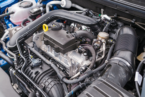 Engine compartment of a modern car, repair or servise of automobile.