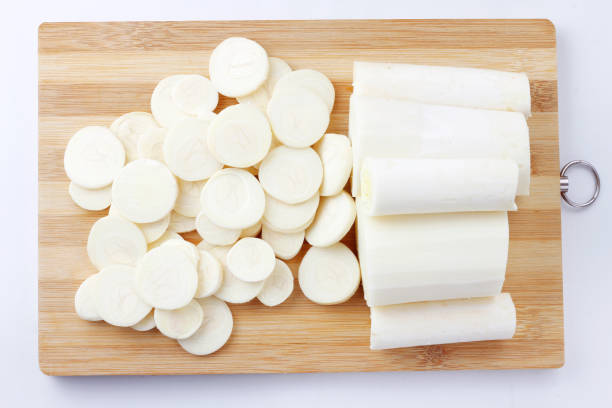 Sliced palm heart palmetto salad in wooden table isolated on white background Sliced palm heart palmetto salad in wooden table isolated on white background. Low carb food palm heart photos stock pictures, royalty-free photos & images