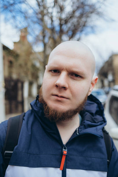 istock A white man with bald head and beard has a rest in a park 1391690128
