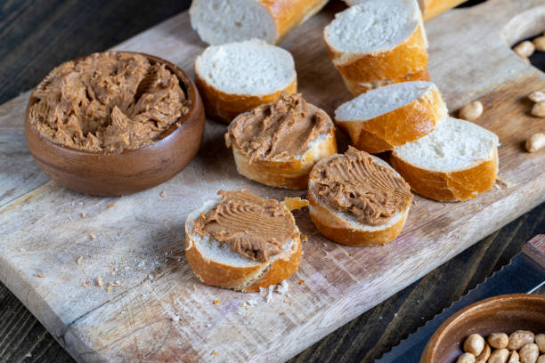 istock peanut paste with pieces of peanuts and white baguette 1391690838