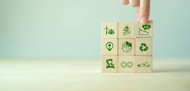 istock Low carbon,carbon neutral concept. Net zero greenhouse gas emissions target. Climate neutral long term strategy. Hand put wooden cubes with decrease carbon emission icon and green icon. Green banner. 1391695736