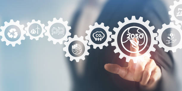 istock Net zero by 2050 concept. Greenhouse gas emissions target. EU commitment. Climate neutral long term strategy. Businessman touching on net zero icon with decarbonization icon on smart background. 1391695784