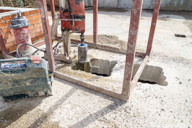 istock installation for drilling large holes in concrete structures, part of the work is done - one hole is drilled 1391697989