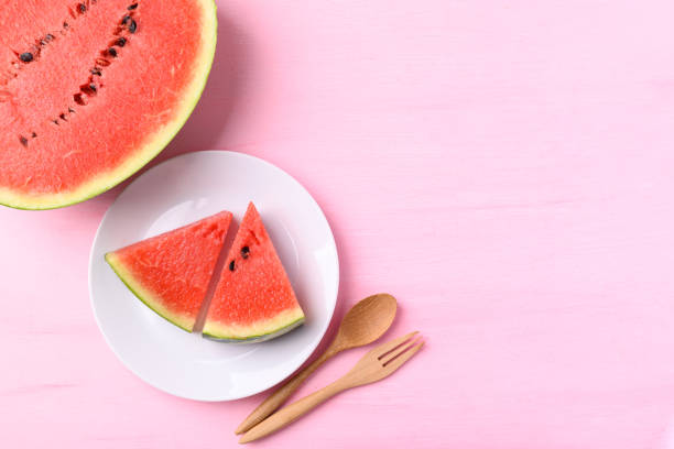 istock Watermelon on pink color background 1391698720