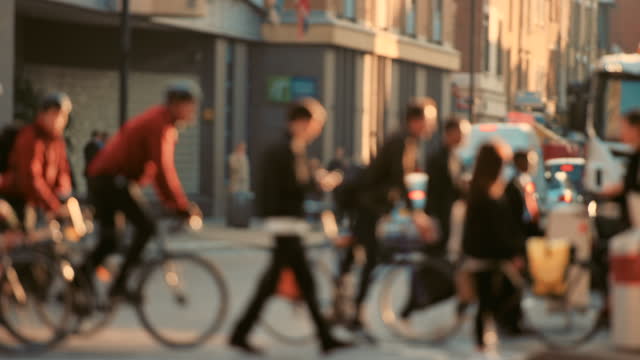 4k video footage of unrecognisable people traveling through the city