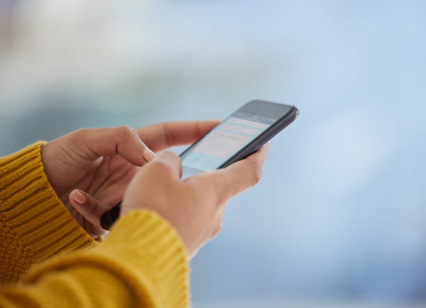 istock Shot of an unrecognizable person using a phone at home 1391708000