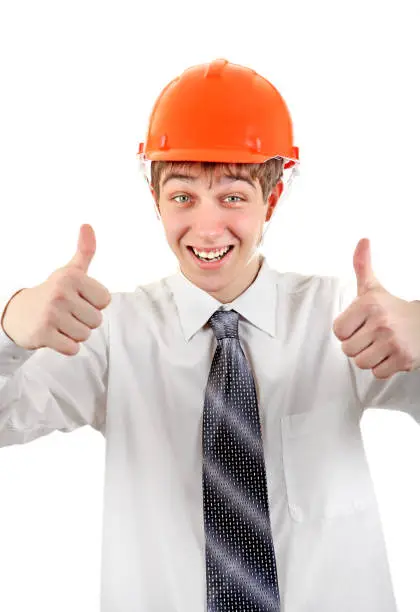 Happy Teenager in Hard Hat showing thumb up Isolated on the white Background