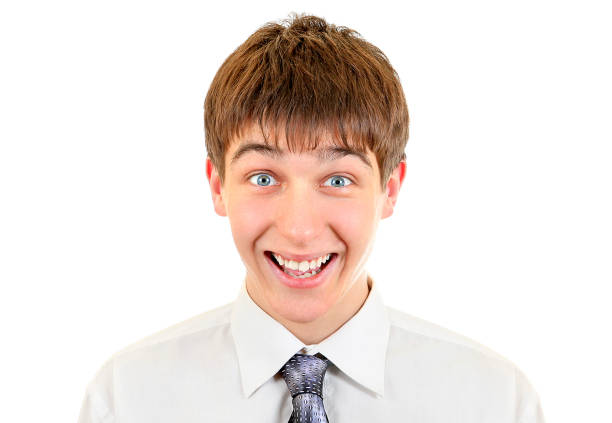 Happy Hispanic Boy on brown muslin. Room for copy.