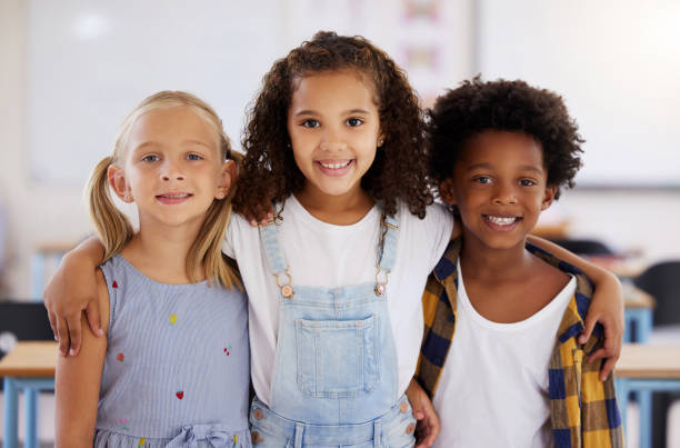 istock Shot of three preschool students standing together in class 1391720691
