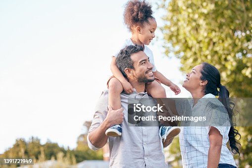 istock Shot of a young couple and their adorable daughter spending time together outdoors 1391721949