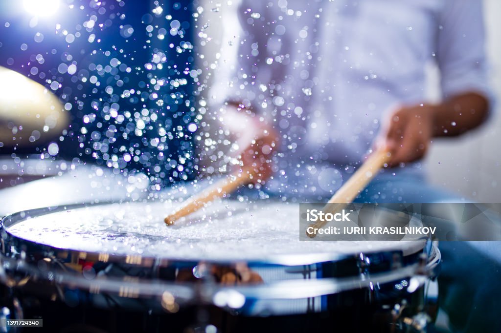 indian man playing the drums sticks close-up in recording studio indian man playing the drums sticks close-up in recording studio . Drummer Stock Photo