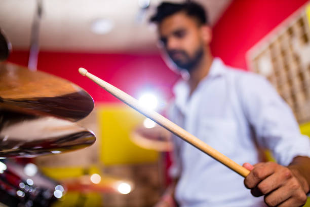 Young arabic man in a professional recording studio.