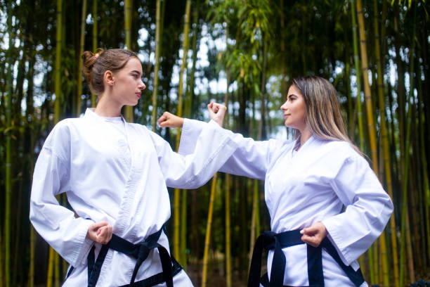 istock people high kicks during training of taekwondo outdoors bamboo background 1391726232