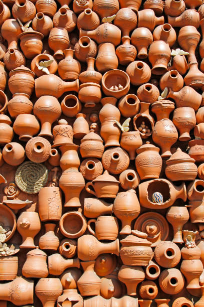 istock Background of handmade ceramic clay brown terracotta pots with names and initials 1391729152