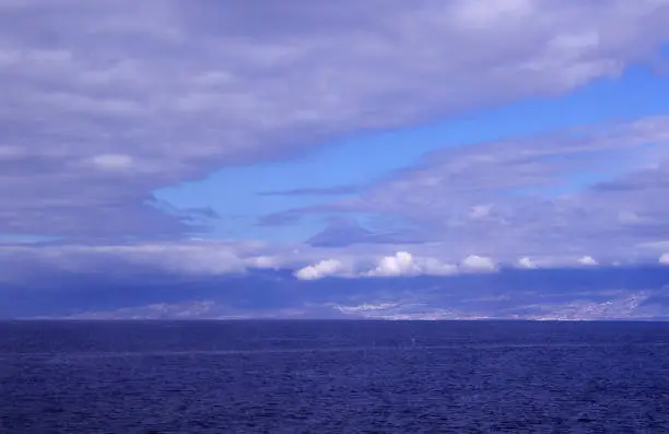 Photo of Tenerife,  as seen from the ocaen level, Teide peak partically covered by clouds