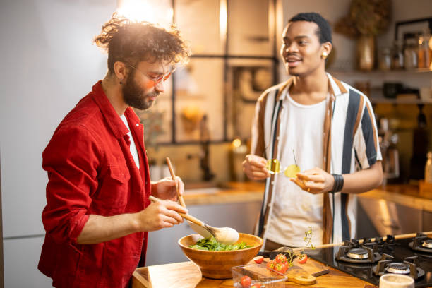 istock Two guys cooking healthy together at home 1391730449