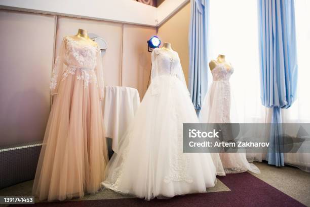 Wedding Dresses Presented On A Fashion Exhibition Stock Photo - Download Image Now - Dressmaker's Model, Wedding Dress, Clothing