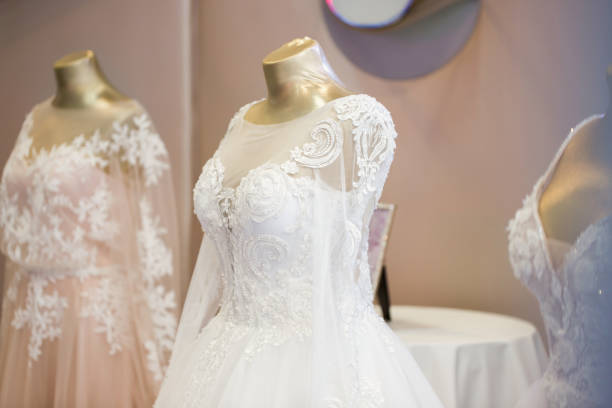 istock Wedding dresses presented on a fashion exhibition. 1391741494
