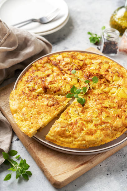istock Frittata or potato pie in a ceramic plate on a light culinary background. Traditional Italian delicious homemade egg dish on the kitchen table 1391742877
