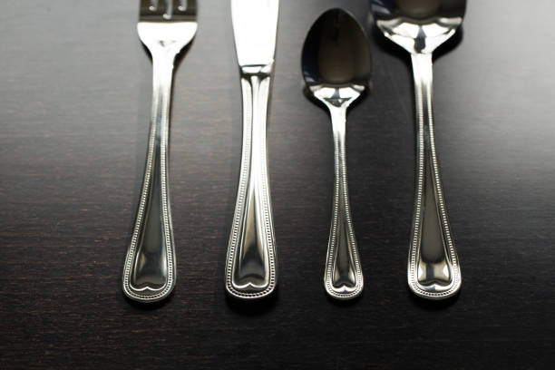 istock Cutlery on a black background. Fork, spoon, knife 1391742899