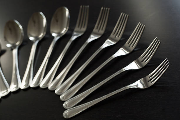 istock Cutlery on a black background. Fork, spoon, knife 1391742931