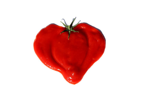 istock The heart is drawn from tomato paste on a white isolated background. 1391743661