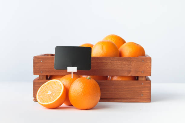 Oranges and a paper shopping bag