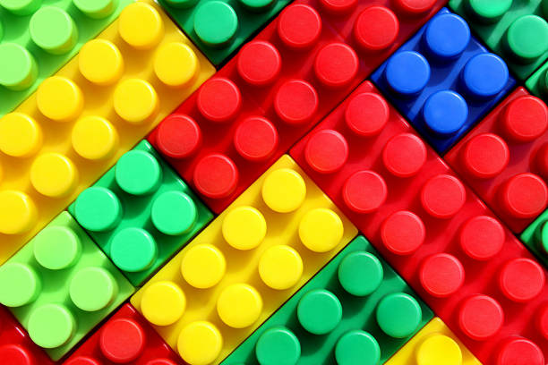 istock Texture of stacked bright, colorful constructor parts 1391744177