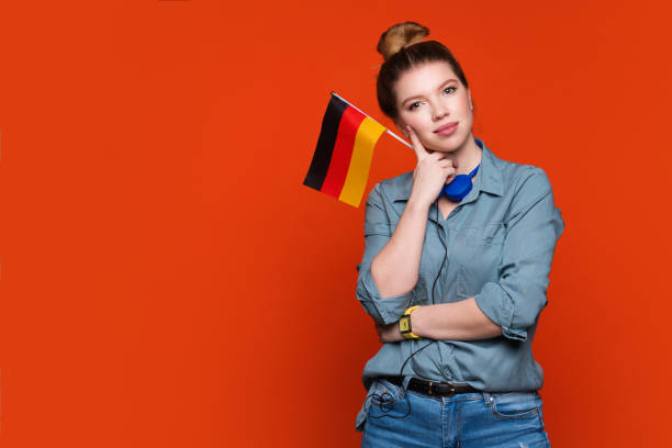 istock woman holds small German flag 1391744340