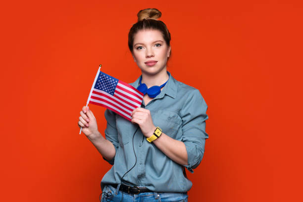 Girl holds small american flag