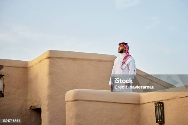 Mid Adult Saudi Man Standing Outdoors Amidst Atturaif Ruins Stock Photo - Download Image Now
