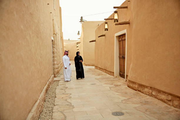 istock Saudi couple visiting UNESCO World Heritage Site near Riyadh 1391746596